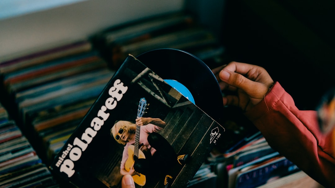 A person holding a dvd in their hand